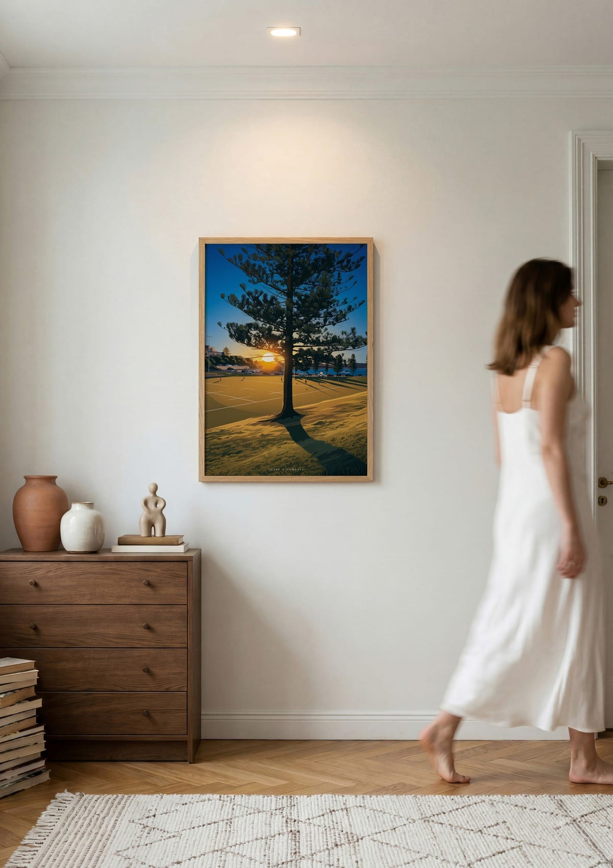 Sunset Shadows print shown on a wall as a woman walks past