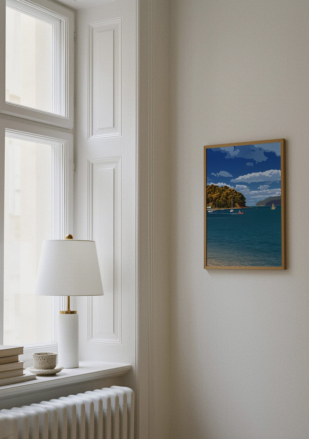 Bay Crossing print shown on a wall beside a window