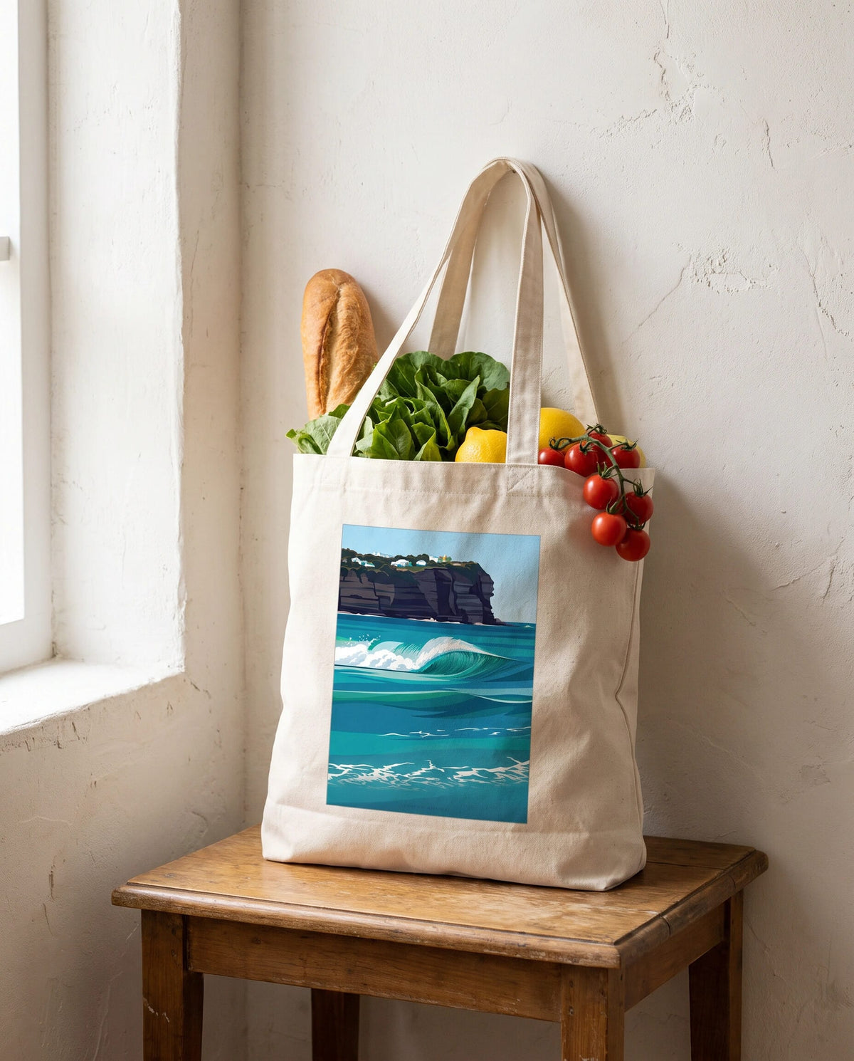Coast & Compass Turquoise Break tote bag packed with fresh groceries, cream cotton canvas printed with the Turquoise Break artwork