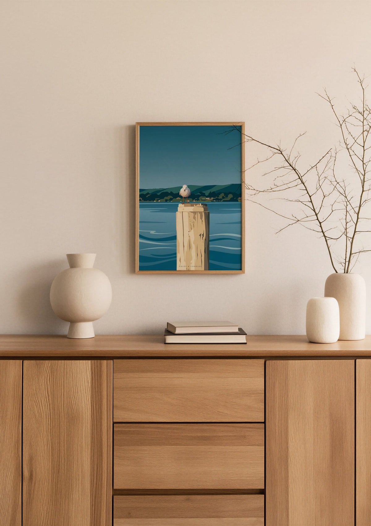 Harbour Watch print shown at A3 size above a sideboard with a branch in a vase