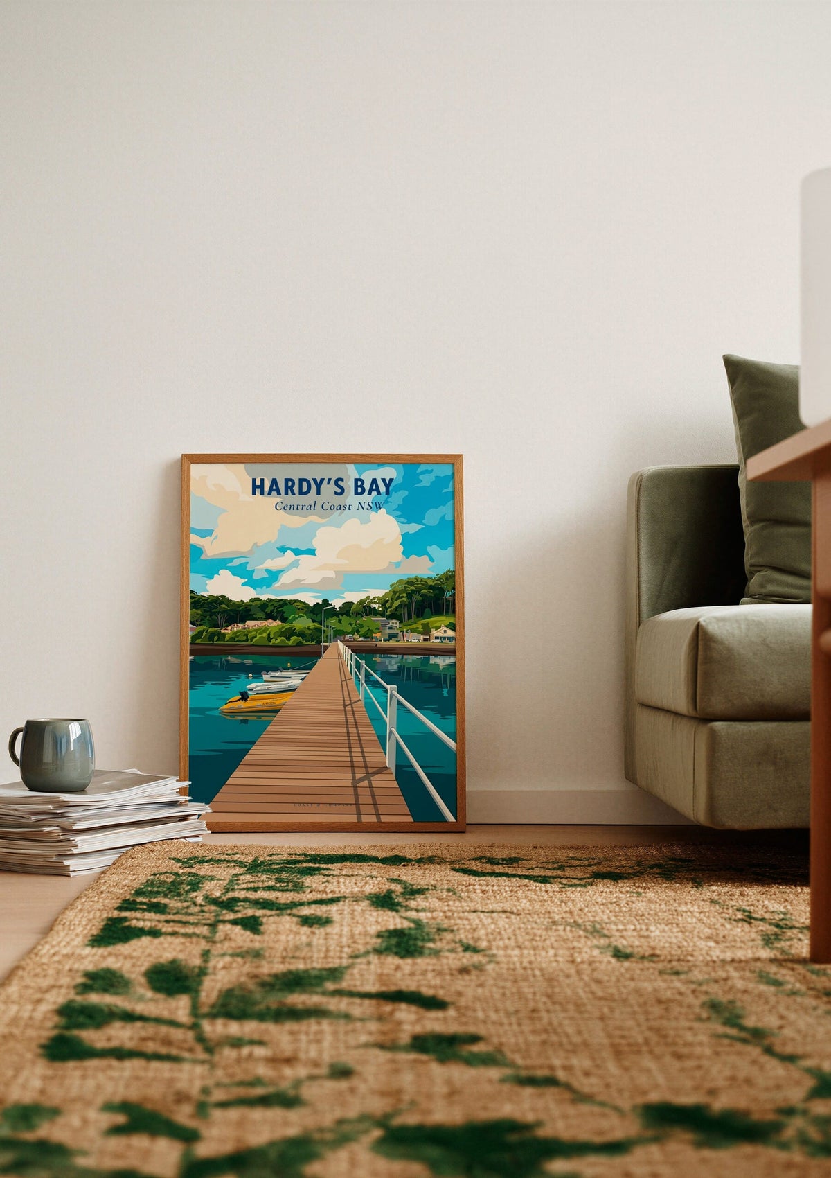 Hardy's Bay travel poster shown unframed, leaning against a wall