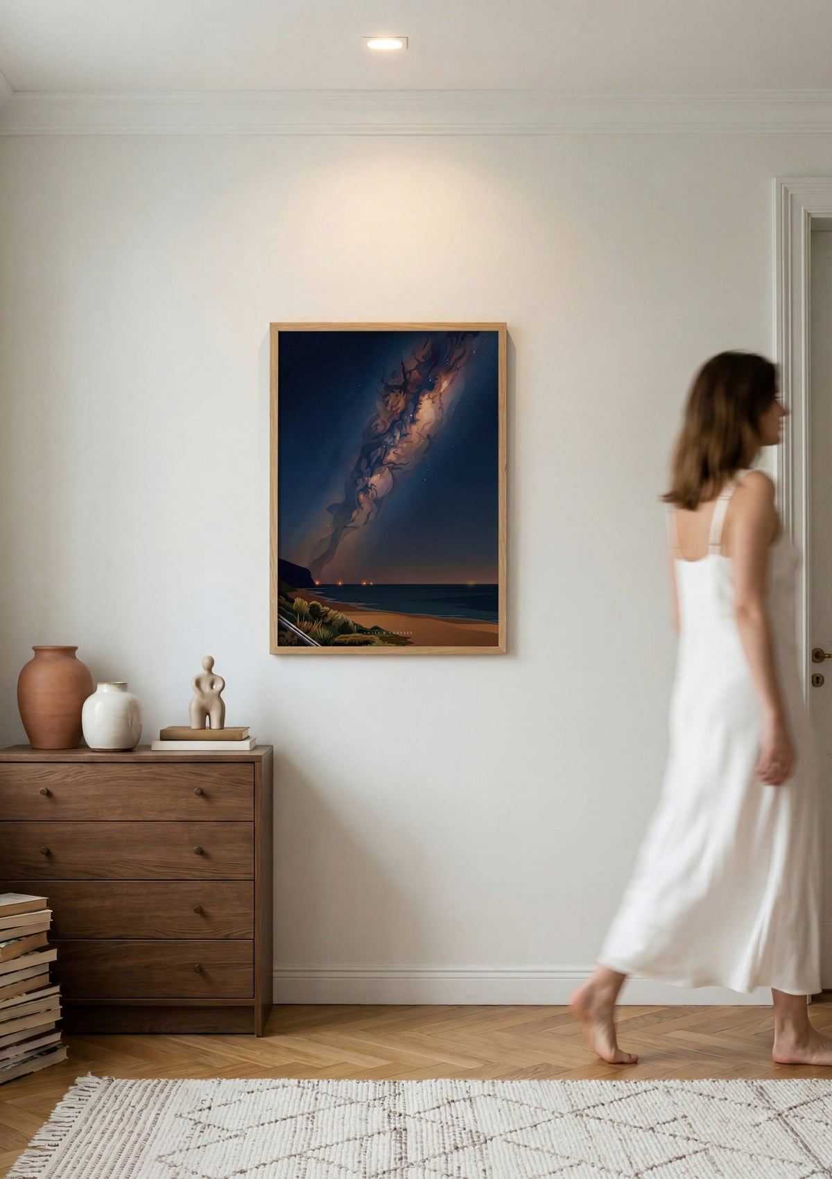 Midnight Bloom print shown on a wall as a woman walks past