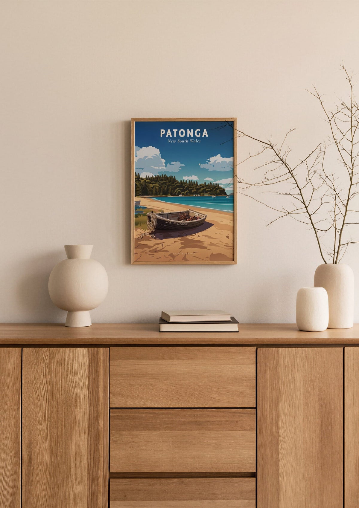Patonga travel poster shown at A3 size above a sideboard with a branch in a vase