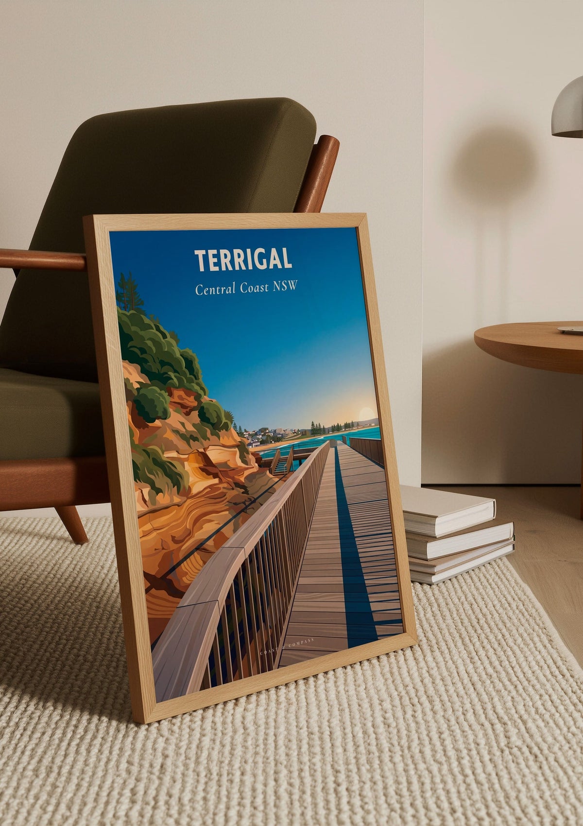 Terrigal Boardwalk travel poster shown unframed, leaning against a chair