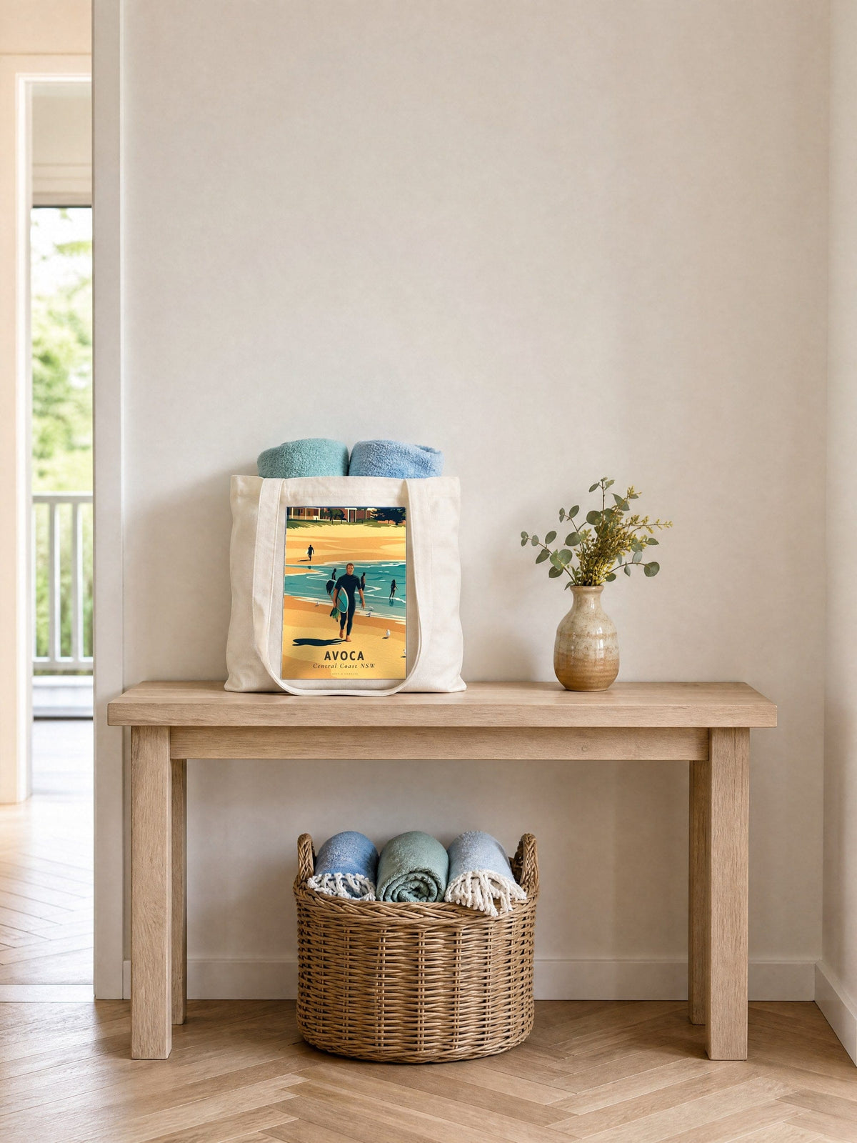 Coast & Compass Avoca tote bag on a timber hall console with rolled beach towels, printed cotton canvas