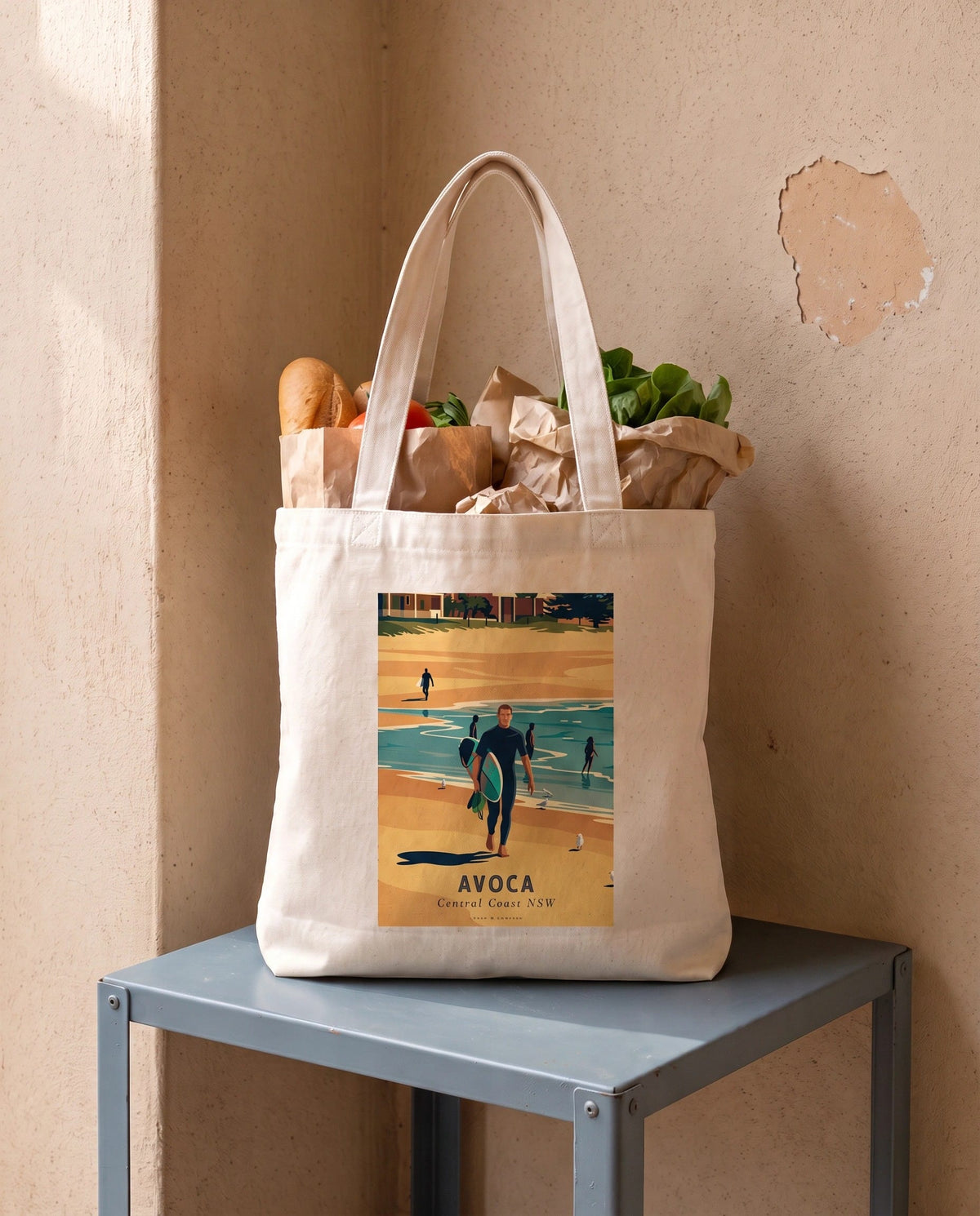 Coast & Compass Avoca Beach tote bag packed with fresh groceries, cream cotton canvas printed with the Avoca Beach Central Coast NSW poster design