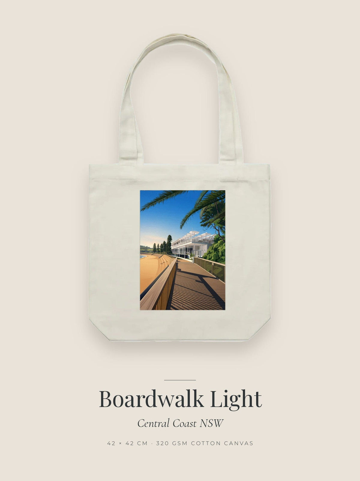 Boardwalk Light artwork printed on a cream cotton canvas tote bag — a timber boardwalk in morning light beside a white beachfront building
