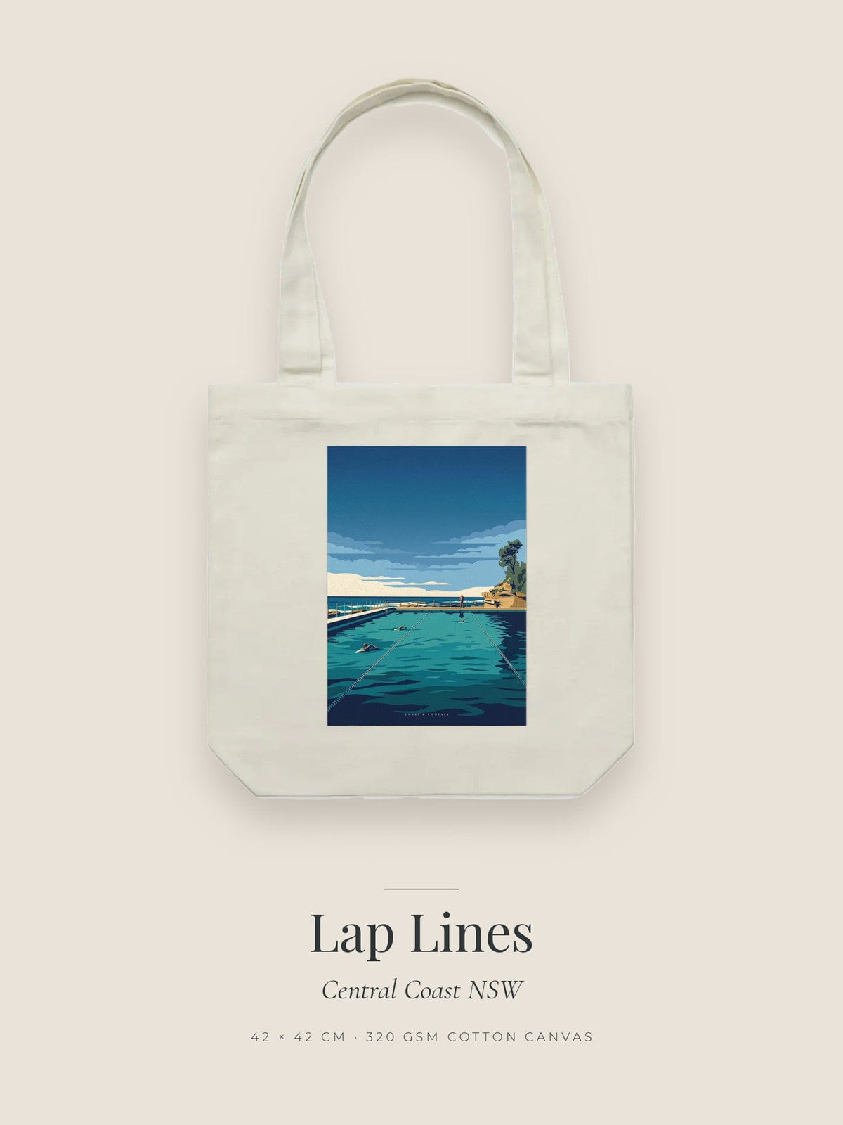 Lap Lines artwork printed on a cream cotton canvas tote bag — swimmers cutting laps in a tidal ocean pool with a figure at the rail