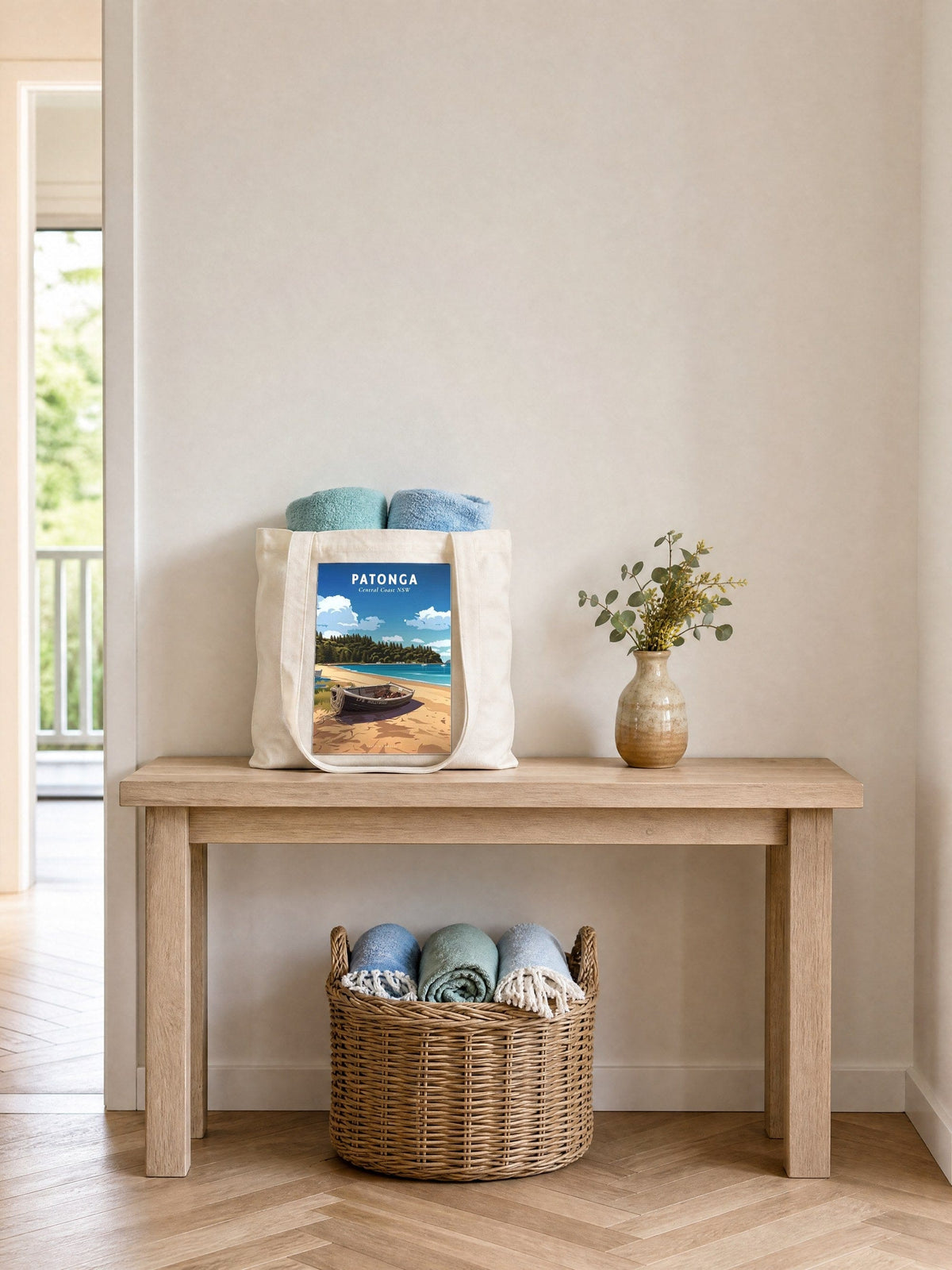 Coast & Compass Patonga tote bag on a timber hall console with rolled beach towels, printed cotton canvas