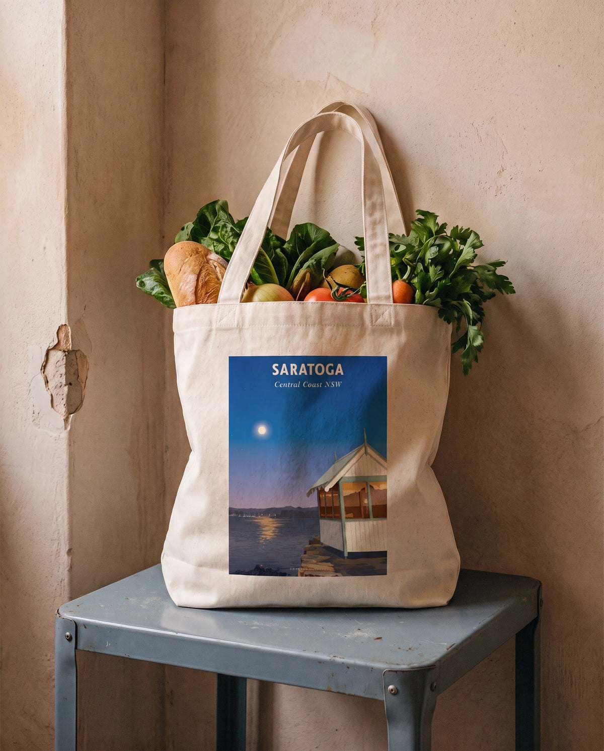 Coast & Compass Saratoga tote bag packed with fresh groceries, cream cotton canvas printed with the Saratoga Central Coast NSW poster design