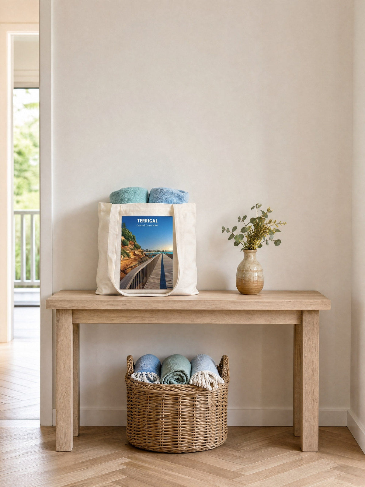 Coast & Compass Terrigal Boardwalk tote bag on a timber hall console with rolled beach towels, printed cotton canvas