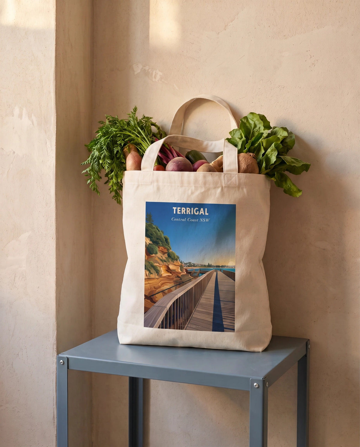 Coast & Compass Terrigal Boardwalk tote bag packed with fresh groceries, cream cotton canvas printed with the Terrigal Boardwalk Central Coast NSW poster design