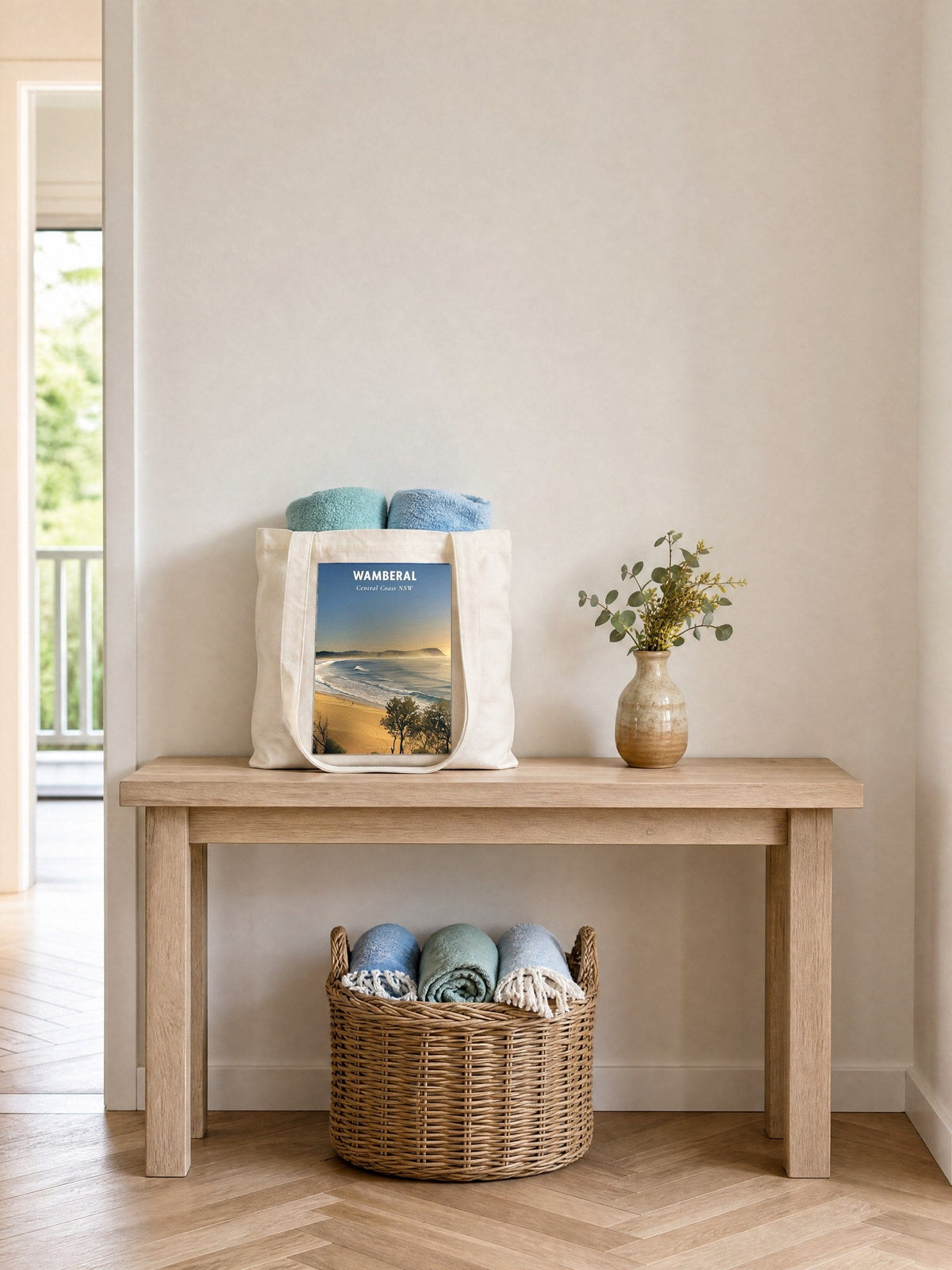Coast & Compass Wamberal tote bag on a timber hall console with rolled beach towels, printed cotton canvas