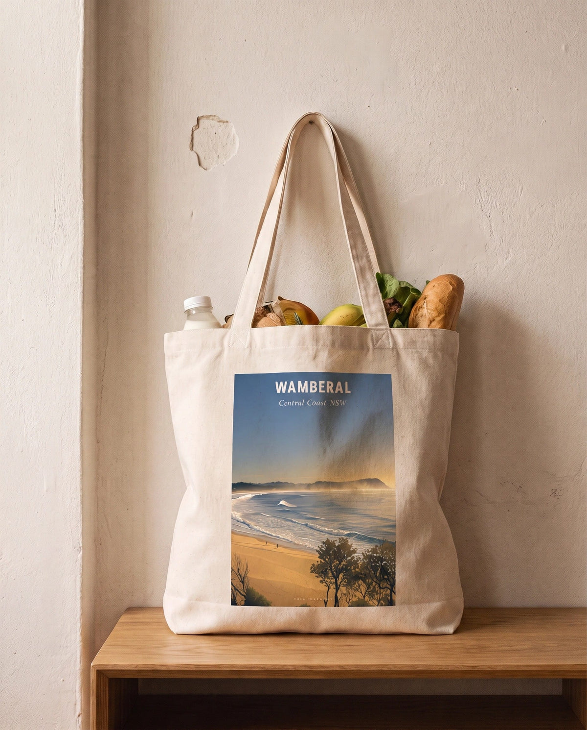 Coast & Compass Wamberal tote bag packed with fresh groceries, cream cotton canvas printed with the Wamberal Central Coast NSW poster design